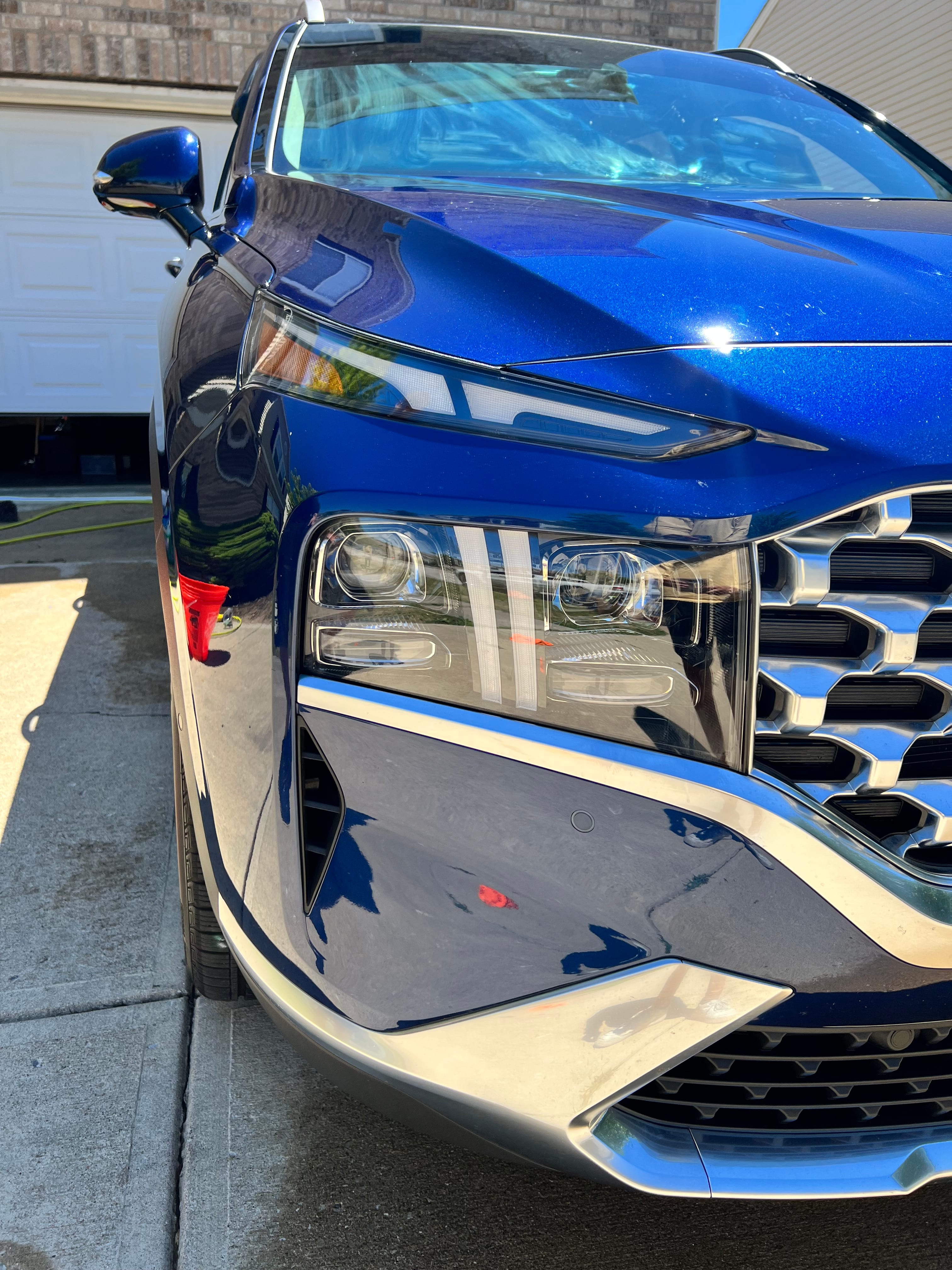 Luxury vehicle headlight and paint mirror finish — post detail